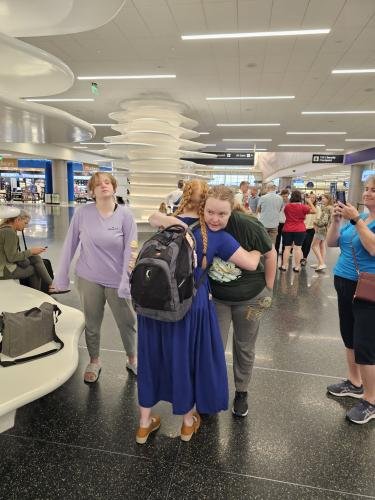Lauren gives Alyssa a hug right before boarding the plane for her mission