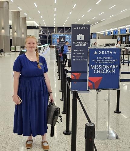 Alyssa waiting to check in for her mission flight