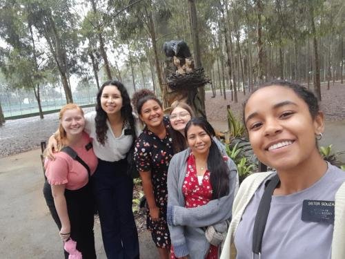 Alyssa and sister Perri with a big group of missionaries