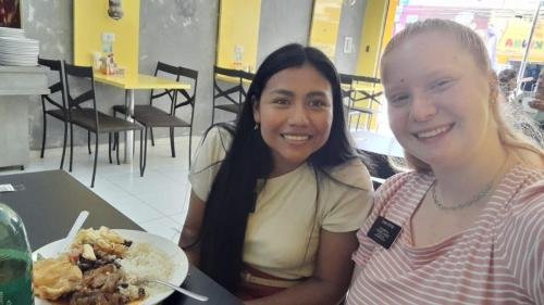 Alyssa and Sister Murrillo eating in a restaurant