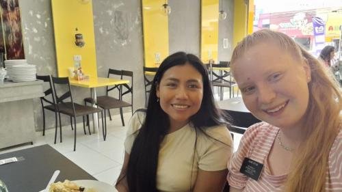 Alyssa and Sister Murrillo eating in a restaurant