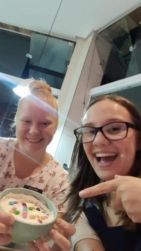Alyssa and Sister Leopoldes with a bowl of food
