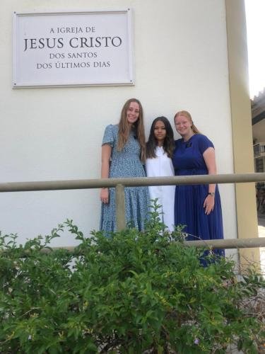 Alyssa and Sister Fuller outside the church house with their friend Maria Alice