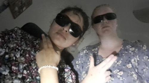 Alyssa and Sister Zurita with their fake guns and sunglasses on