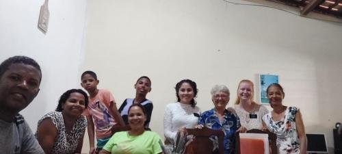 Alyssa and Sister Zurita with a family