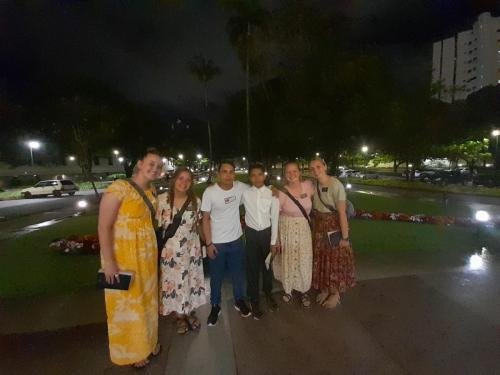 Alyssa and Sister Tadje with a group in front of the temple