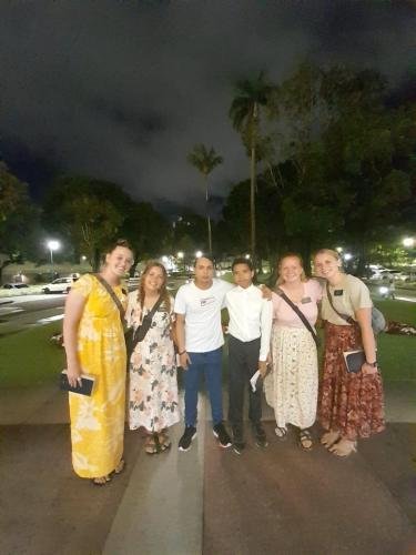 Alyssa and Sister Tadje with a group in front of the temple