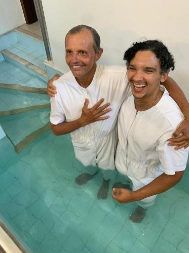 Nilton in the font before his baptism