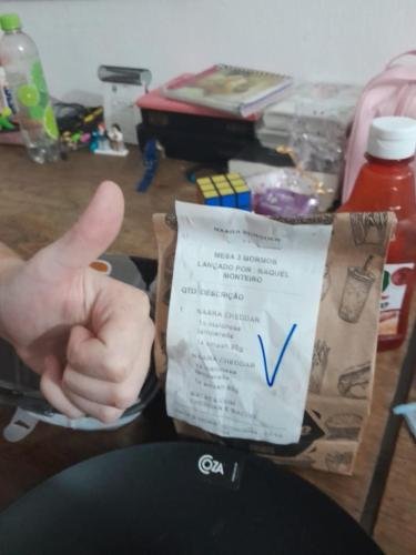 Alyssa gives her bag of food a big thumbs up