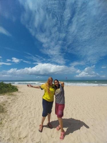 Alyssa and Sister Quispe on the beach at the mission party
