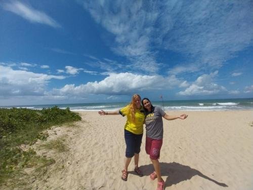 Alyssa and Sister Quispe on the beach during the mission party