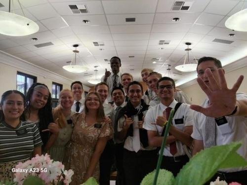 Alyssa with Sisters Quispe, Santiago, and Lima with the elders during a meeting