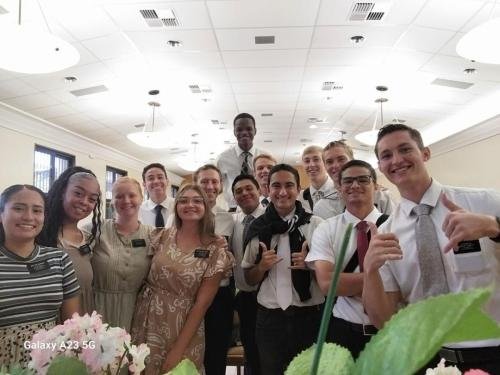 Alyssa with Sisters Quispe, Santiago, and Lima with the elders during a meeting