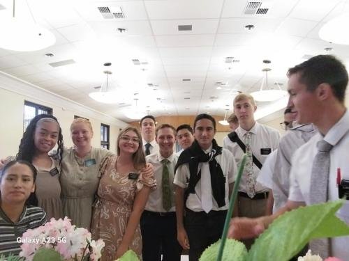 Alyssa with Sisters Quispe, Santiago, and Lima with the elders during a meeting
