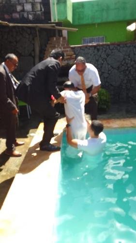 Paulo exits the swimming pool after his baptism