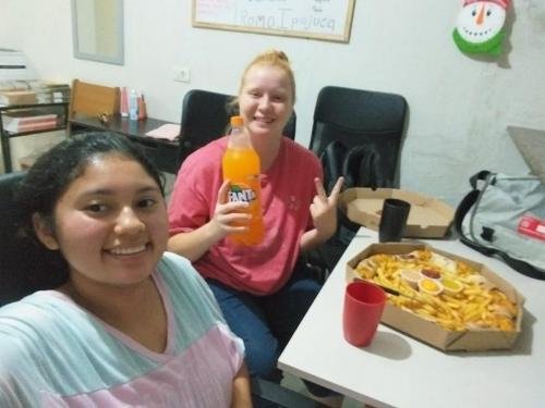 Alyssa and Sister Flores with a french fry pizza