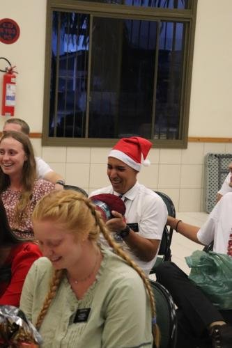 Alyssa and other missionaries open presents during their 2023 mission party