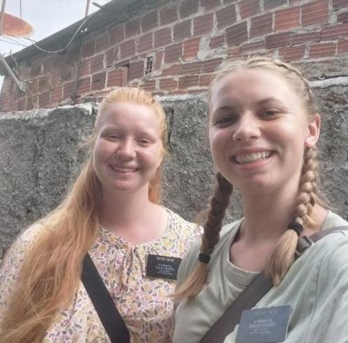 Alyssa and Sister Tadje by a wall