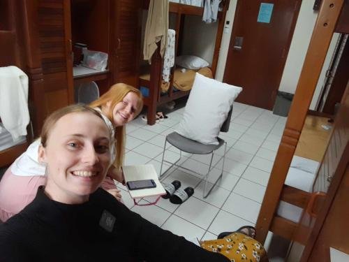 Sister Fuller and Sister Grace practice teaching to a pillow chair person