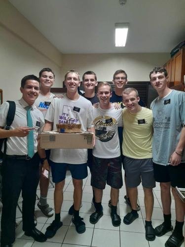 The Elders in Alyssa's district with Elder Benson's makeshift birthday cake