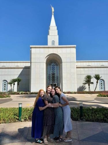 Alyssa and Sister Fuller in front of the Campinas Brazil Temple