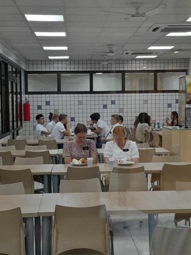 Sisters Grace and Fuller praying before their meal
