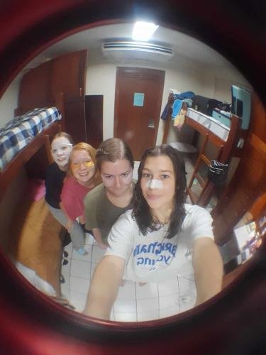 Alyssa and her roommates with fish eye lens and facemasks